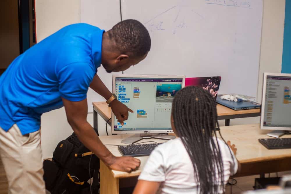 Teacher guiding a student