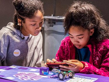 AWS Image of two girls using robot